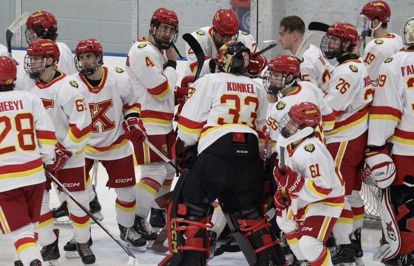 Stefan Lakoseljac with his team gathered around the net