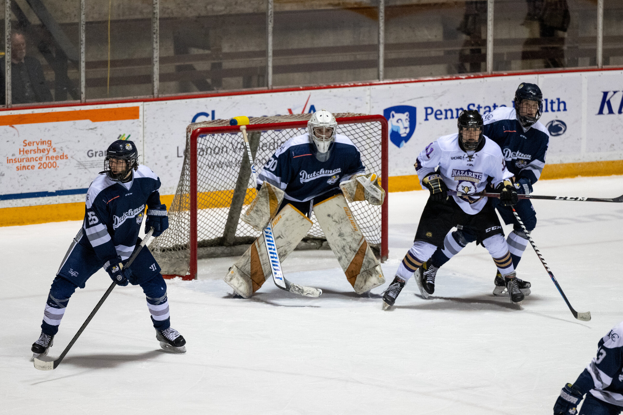 Stefan Lakoseljac and players competing around the net
